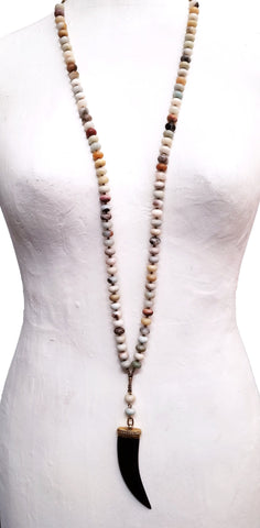 2223 Carved black horn pendant on amazonite and brass bead long necklace.